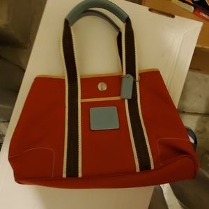 Red with brown and blue trim coach purse.